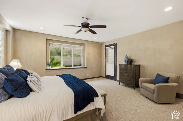 Recessed lighting, ceiling fan, and carpeted flooring