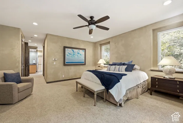 Recessed lighting throughout, accompanied by a ceiling fan with integrated lighting