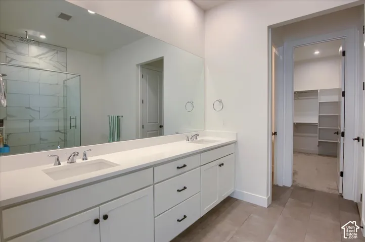 Dual vanity with integrated sinks and white cabinetry