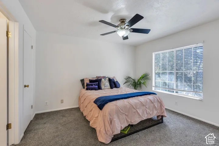 Recessed lighting, ceiling fan, window with blinds, and wall-to-wall carpeting