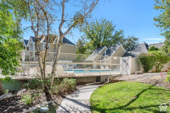 Community pool with deck and surrounding fence
