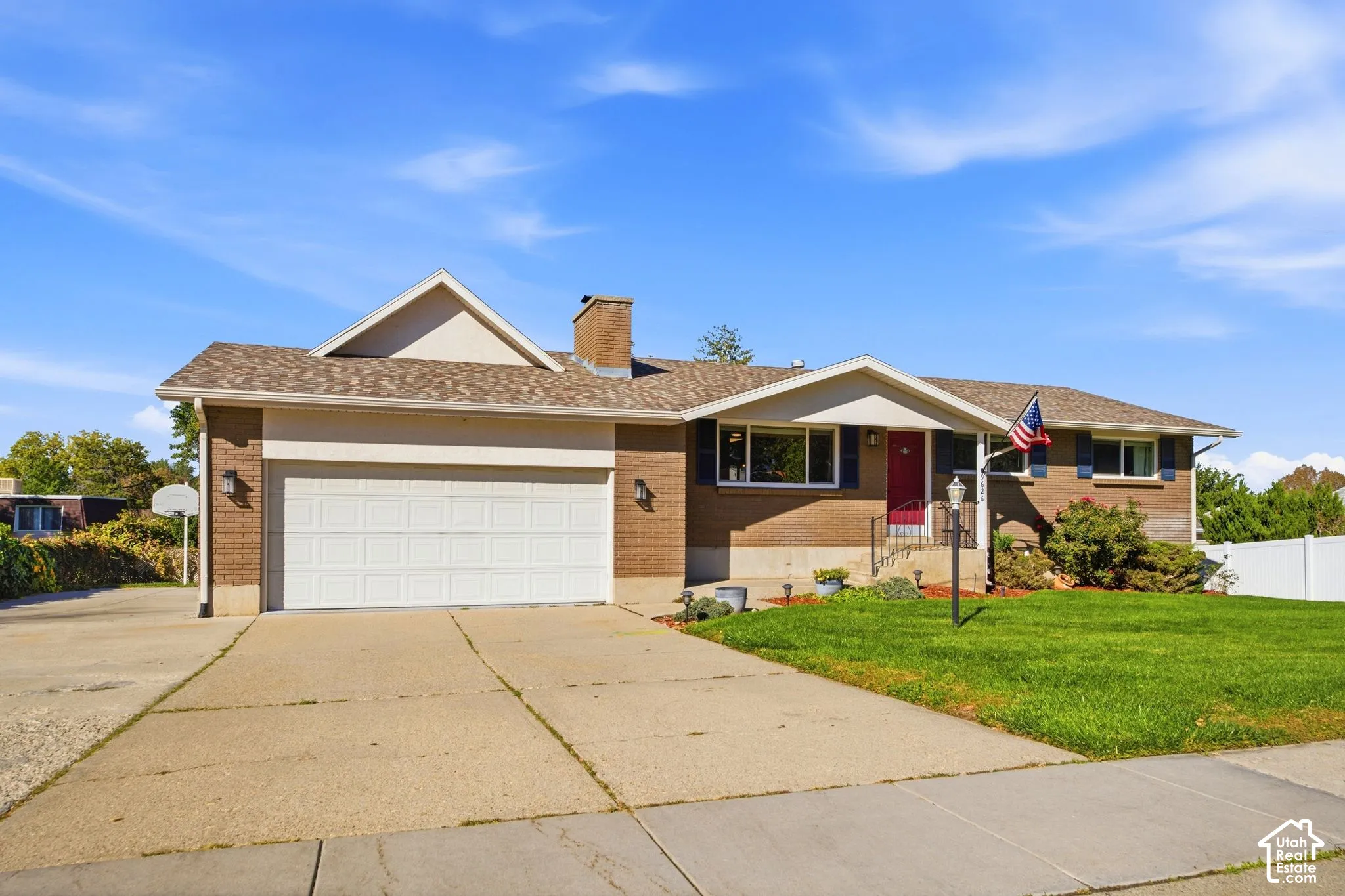 Brick exterior with a gabled roof and attached garage