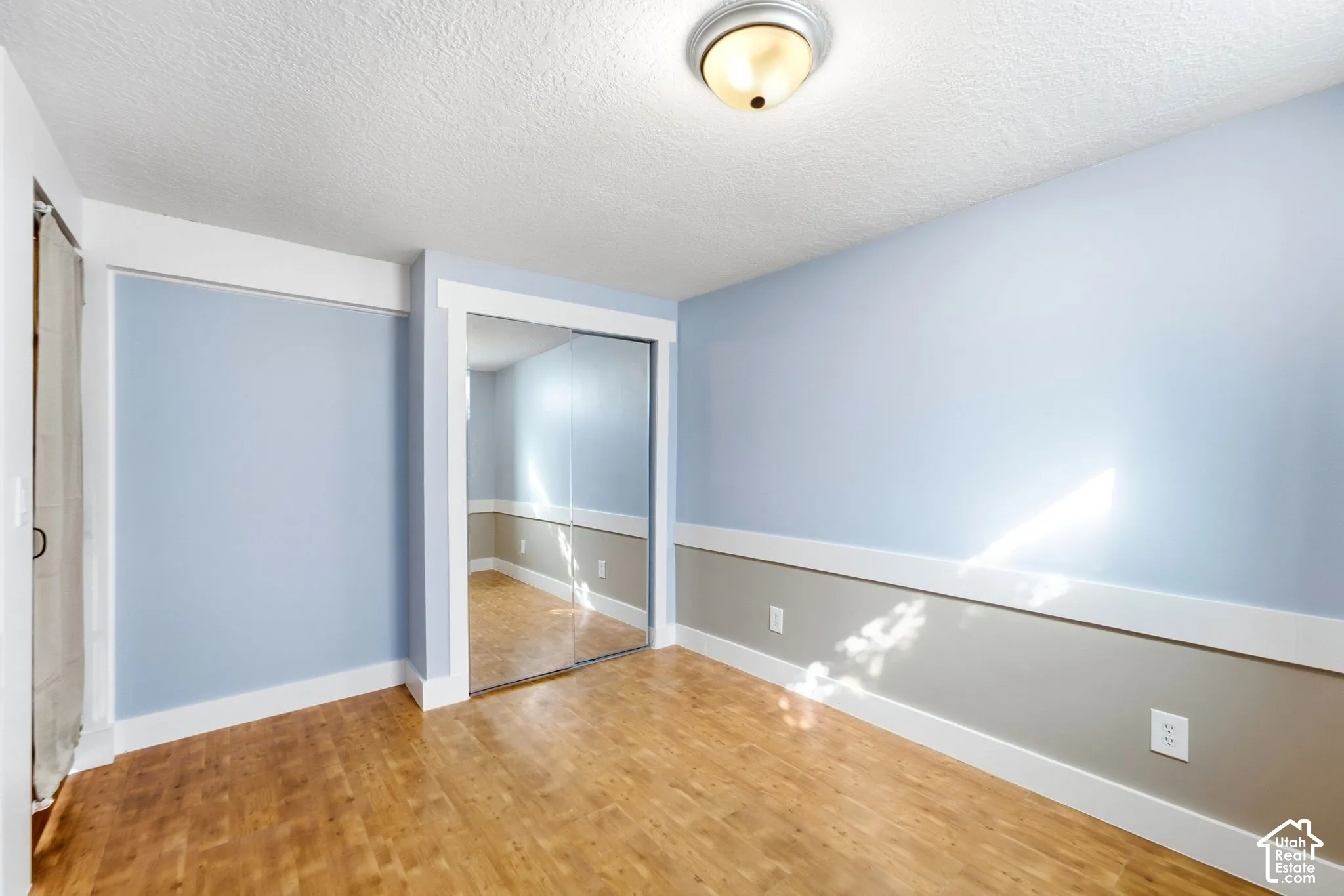Wood-finish flooring with a two-tone wall treatment