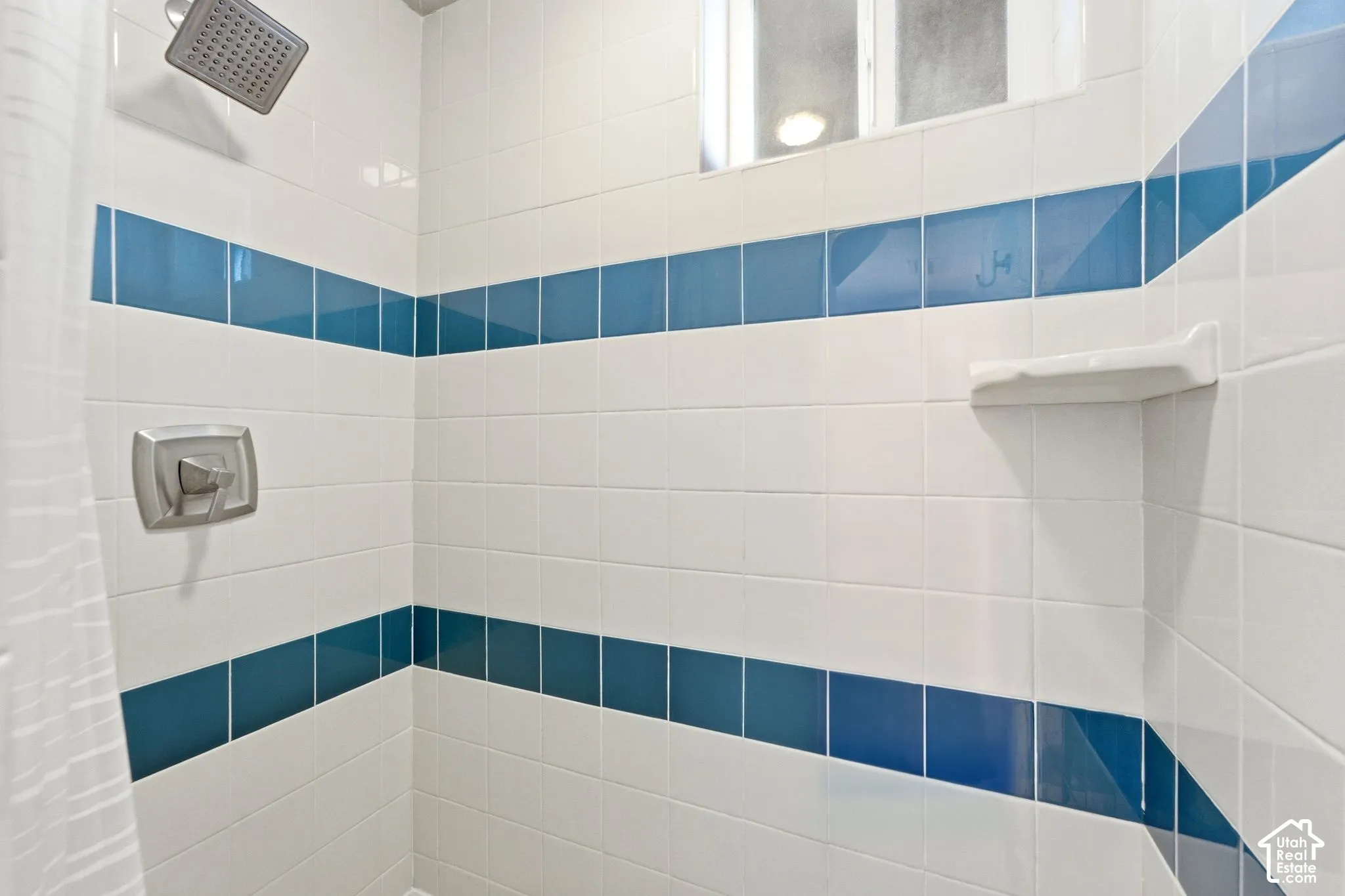 White ceramic wall tile with blue accent bands