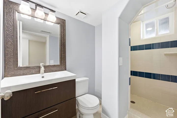 Vanity with an integrated sink and wood-finish cabinetry
