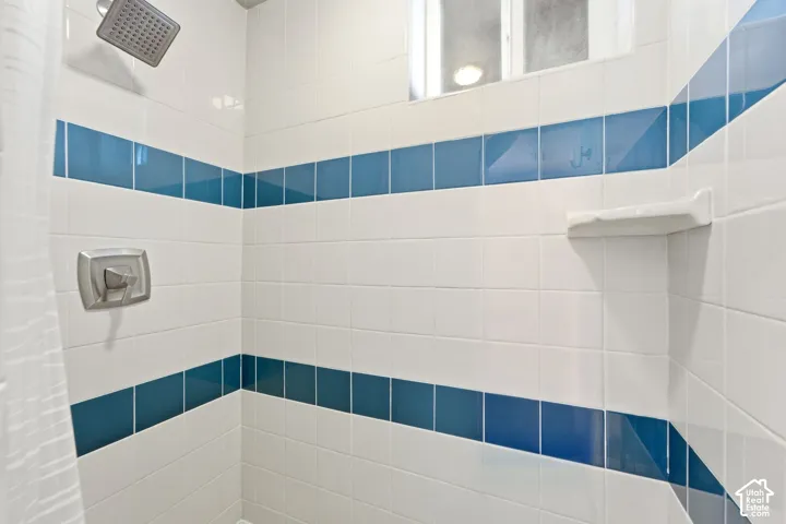 White ceramic wall tile with blue accent bands