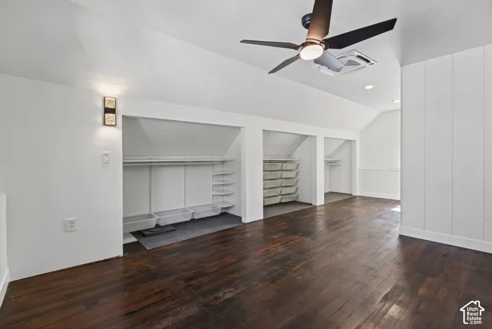 Dark wood-finish flooring with white walls and ceiling
