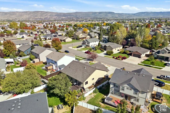 Established neighborhood setting featuring mature trees and distant mountain scenery