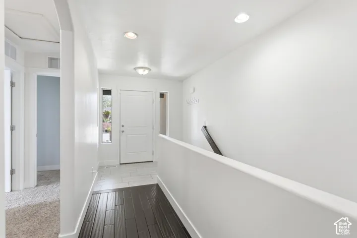 Entryway featuring a white paneled door, sidelight windows, recessed lighting, and a flush mount light fixture