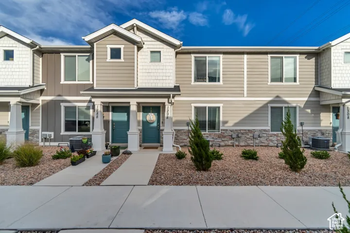 Contemporary exterior featuring horizontal siding, shake siding, and stone accents