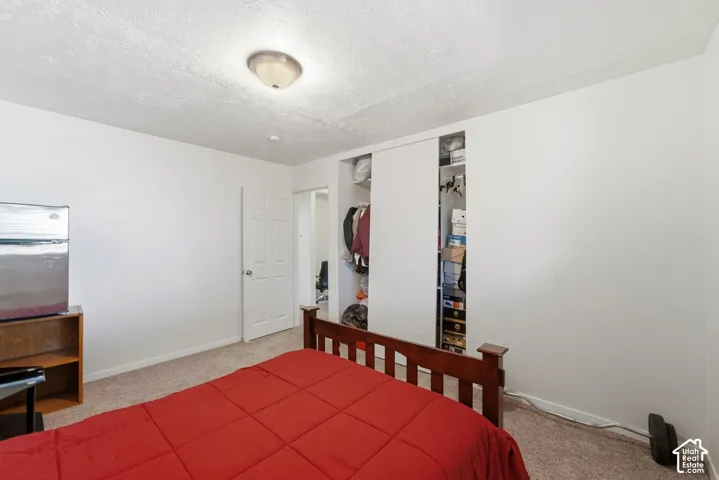 Built-in closet with sliding doors and interior shelving