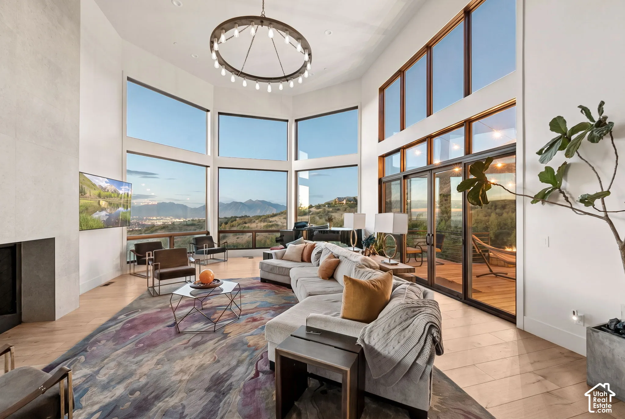 Expansive living area with soaring ceilings and wood-finish flooring