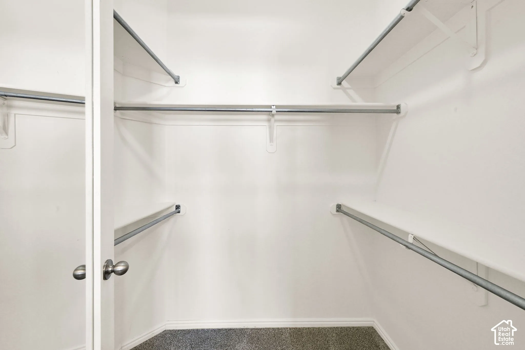 Primary bedroom walk-in closet