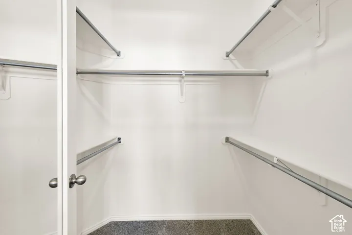 Primary bedroom walk-in closet