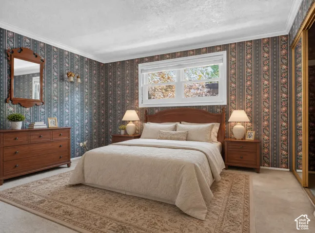 Wall-to-wall carpeting and floral-patterned wallpaper