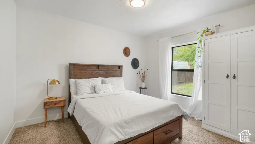 Wood-finish bed frame with integrated storage drawers
