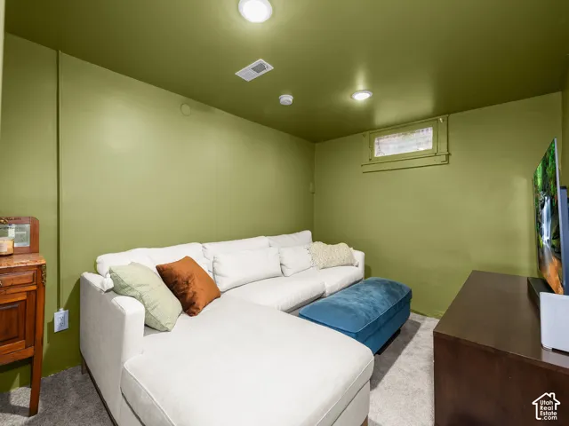 Recessed ceiling lighting, window with trim, and wall-to-wall carpeting