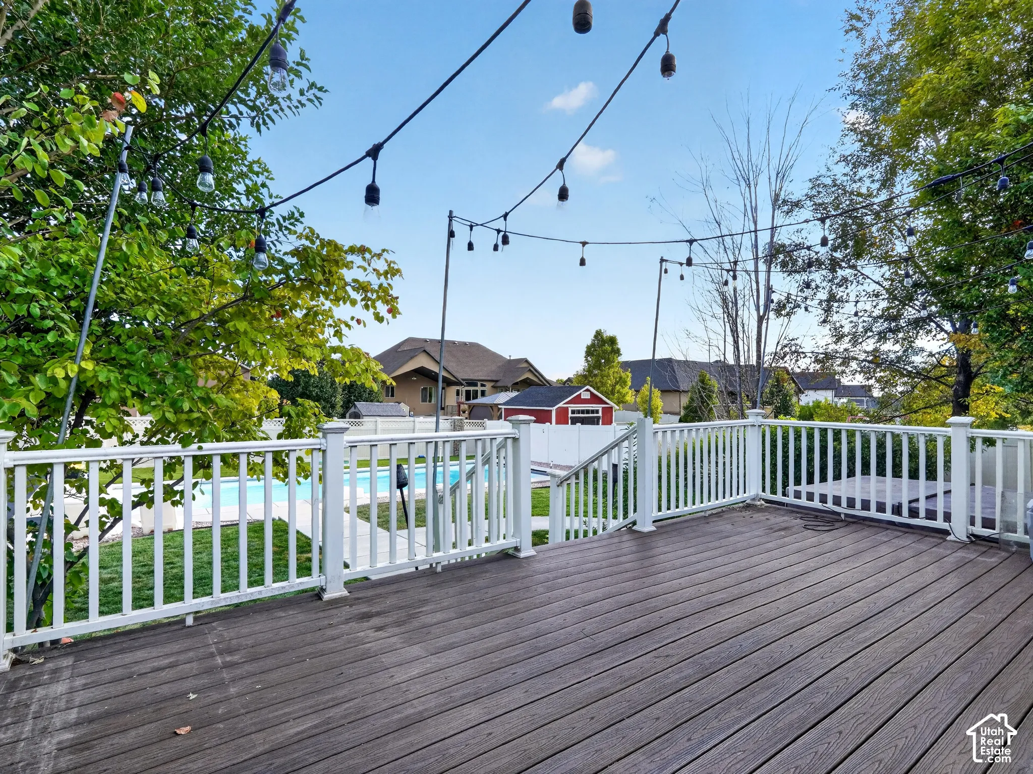 Expansive outdoor deck with composite decking and white railings