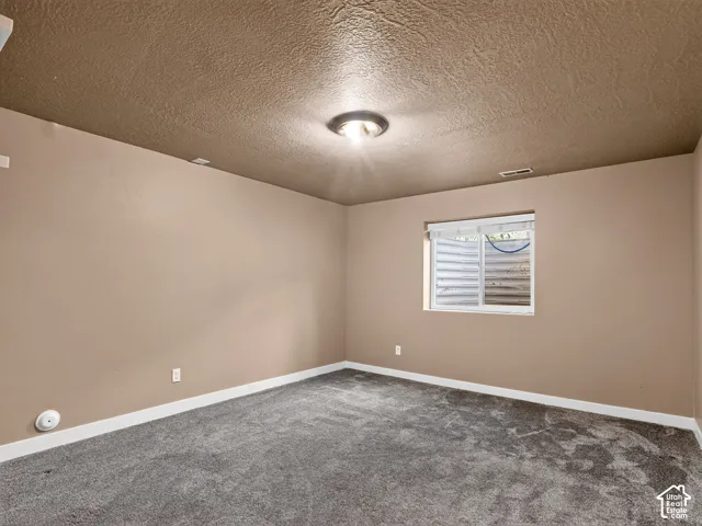 Neutral-toned walls complement the textured ceiling
