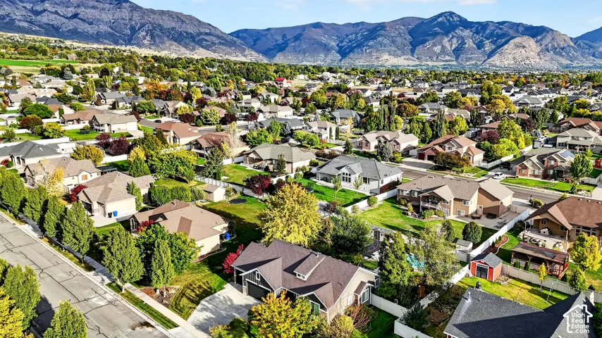 Residential neighborhood with varied architectural styles set against a prominent mountain backdrop