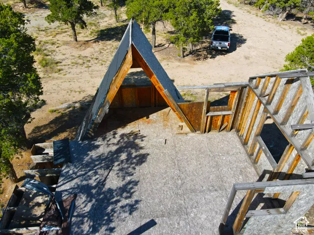 Framed A-frame structure with exposed timber beams and wood sheathing