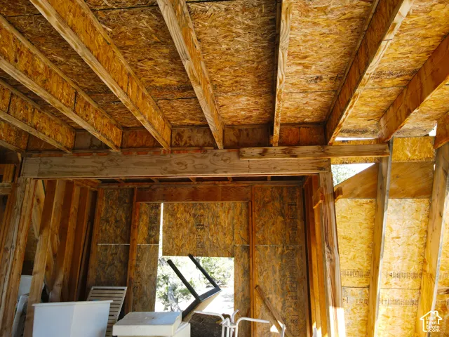 Exposed wood ceiling joists and oriented strand board subflooring