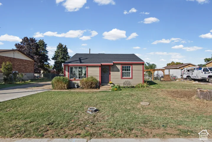 Single-story property with gray siding and red trim accents