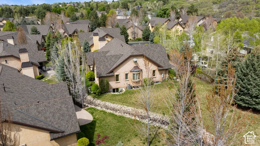 Exterior featuring a bay window, stucco siding, and a gabled roofline