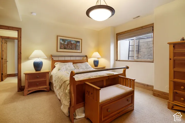 Recessed window with wood trim, built-in window shade, and light-colored walls