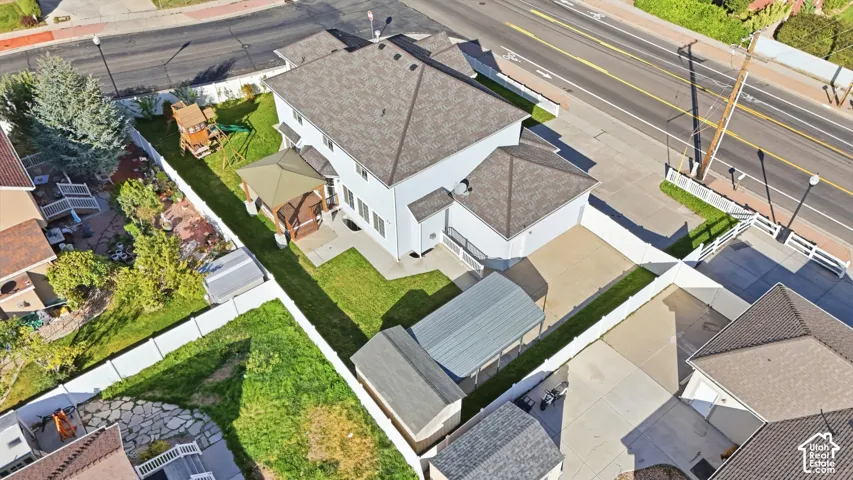 Expansive property featuring a two-story residence, asphalt shingle roofing, and a substantial driveway