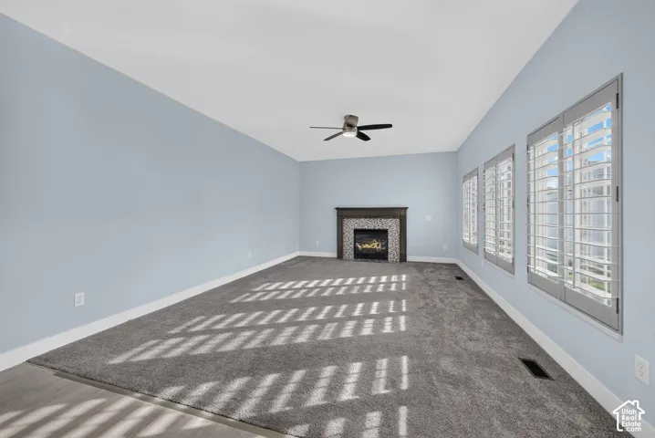 Electric fireplace with a tiled surround and wood mantel