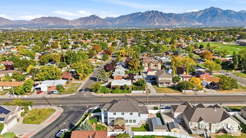Mountain backdrop with a residential neighborhood featuring established trees