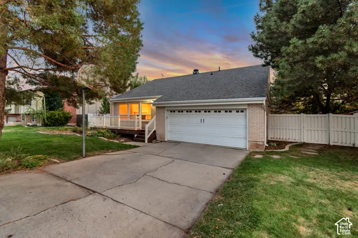 Attached garage with a white sectional door