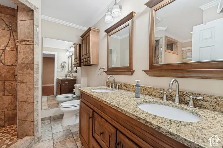 Dual vanity with granite countertops, undermount sinks, and brushed nickel fixtures