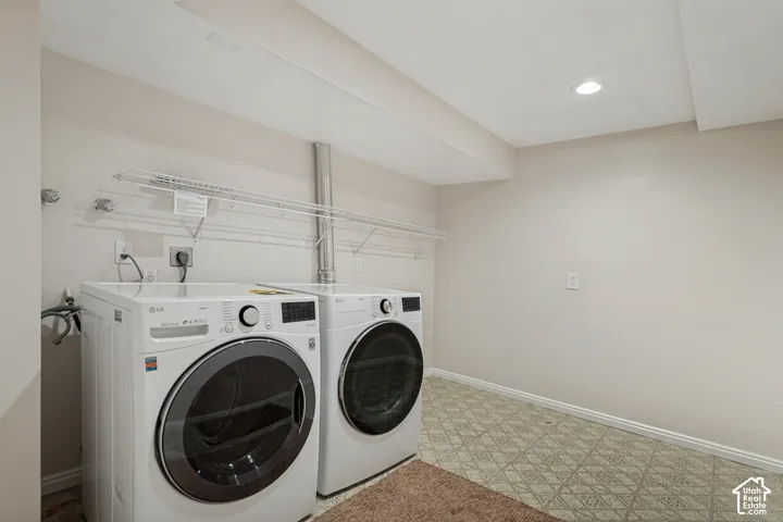 Utility area with patterned flooring, recessed lighting, white wire shelving, and neutral wall tones