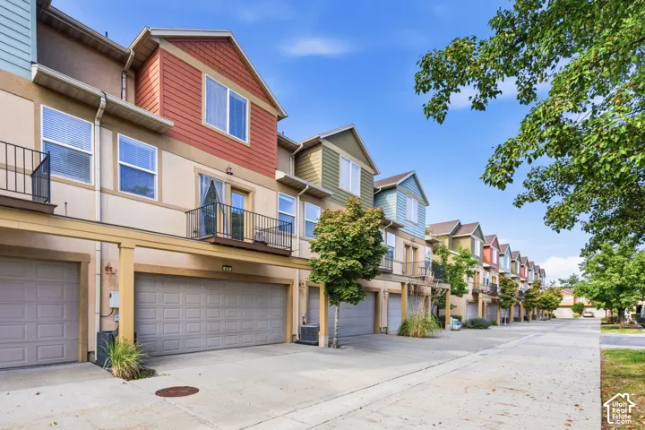 Multi-level townhome with an attached 2 car garage, private back balcony and front patio