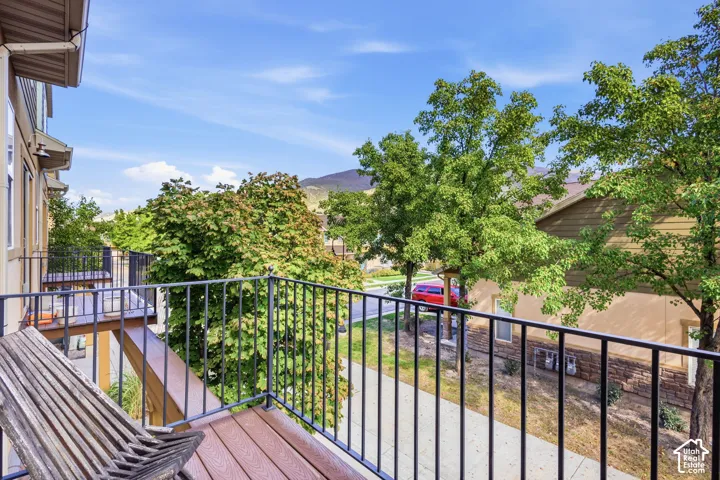 Balcony with composite decking and black metal railing