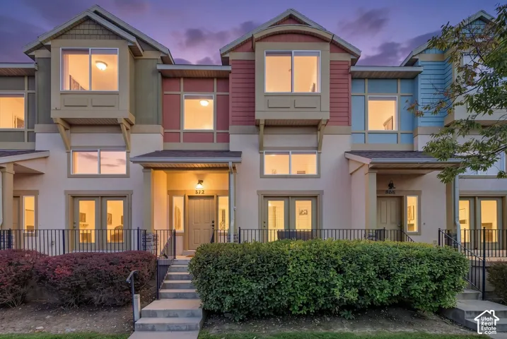 Multi-level exterior with varied siding, including horizontal panels and stucco