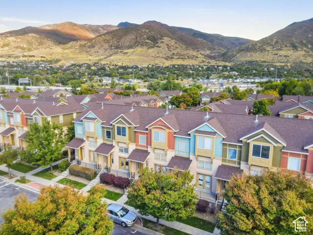 Townhome community with vibrant exterior colors and pitched roofs