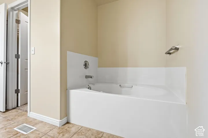 Large soaking tub in primary bathroom