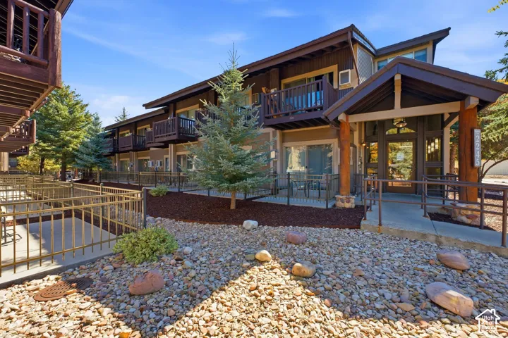 Wood-finish exterior with multiple private balconies