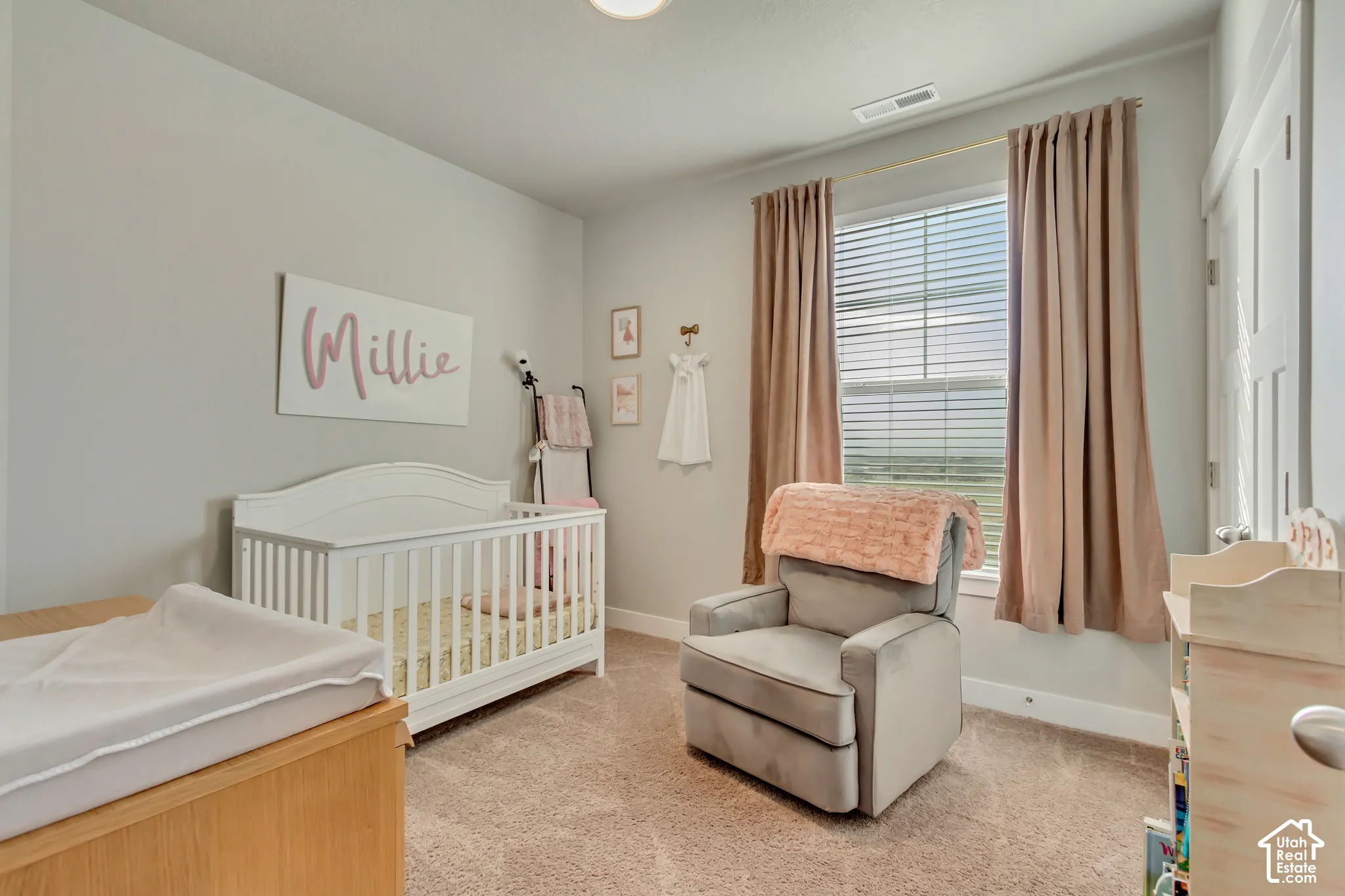 Neutral wall color with textured carpet flooring