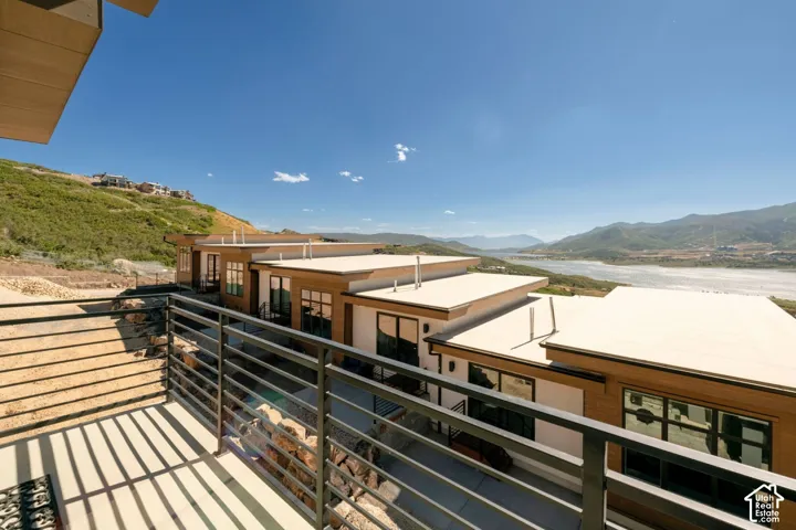 Modern architectural design featuring expansive windows, wood-finish siding, and a flat roofline