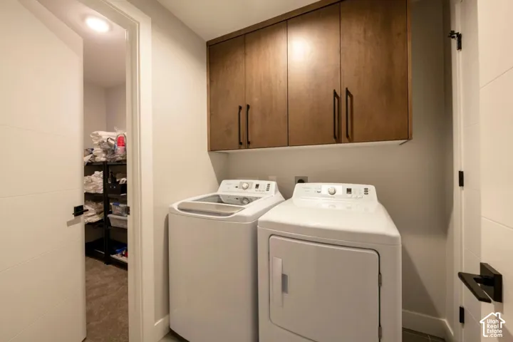 Wall-mounted wood-finish cabinetry, contemporary flat-panel doors, and recessed lighting