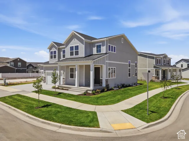 Modern Colonial-style exterior with gray siding and white trim
