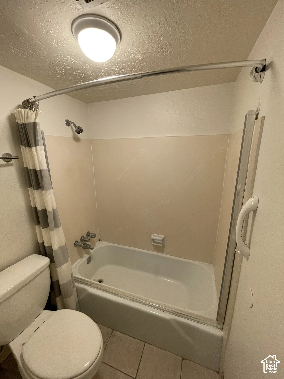 Built-in bathtub with shower head and chrome fixtures