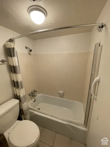 Built-in bathtub with shower head and chrome fixtures
