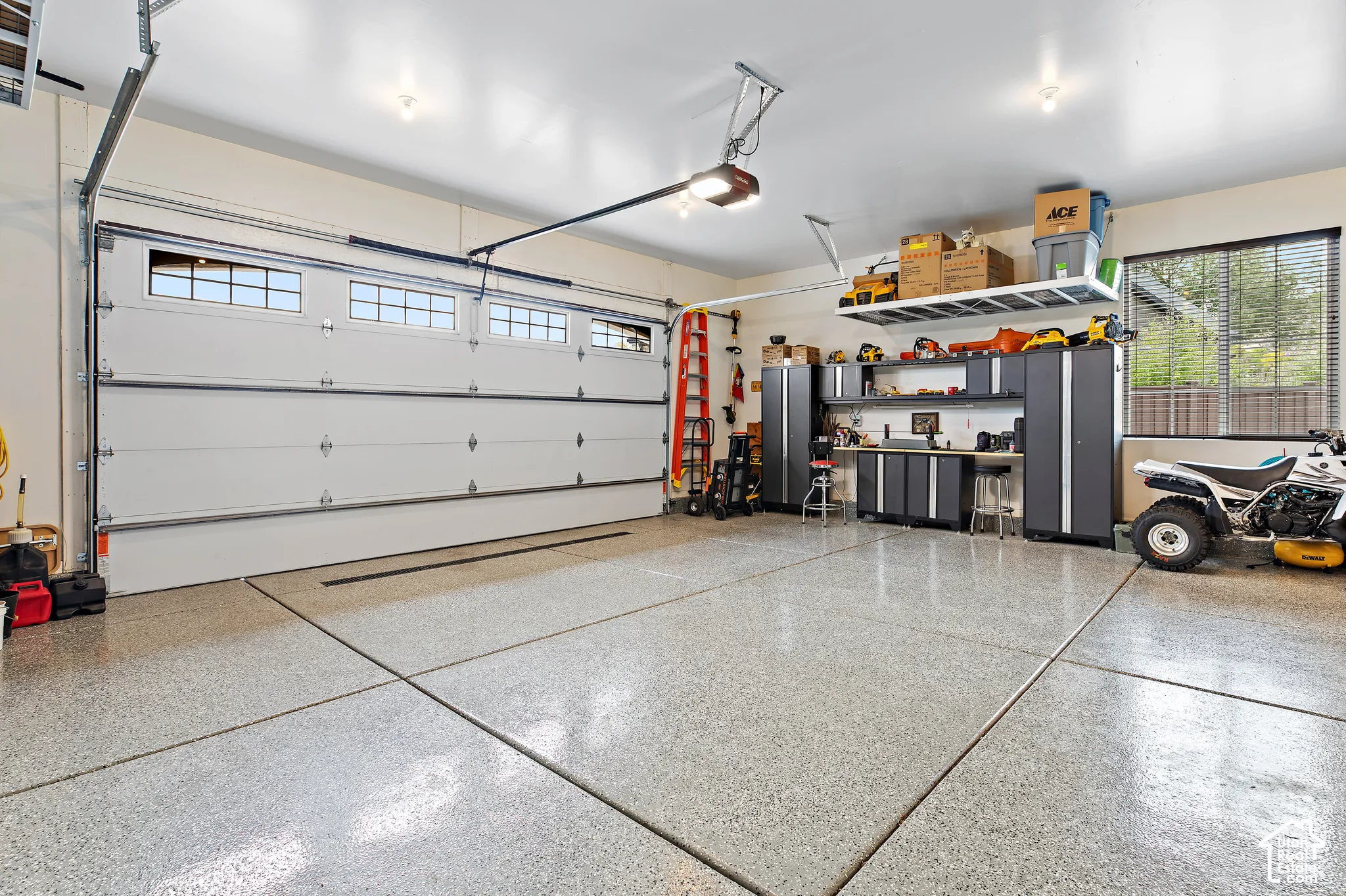 Two large garage doors with upper window panels