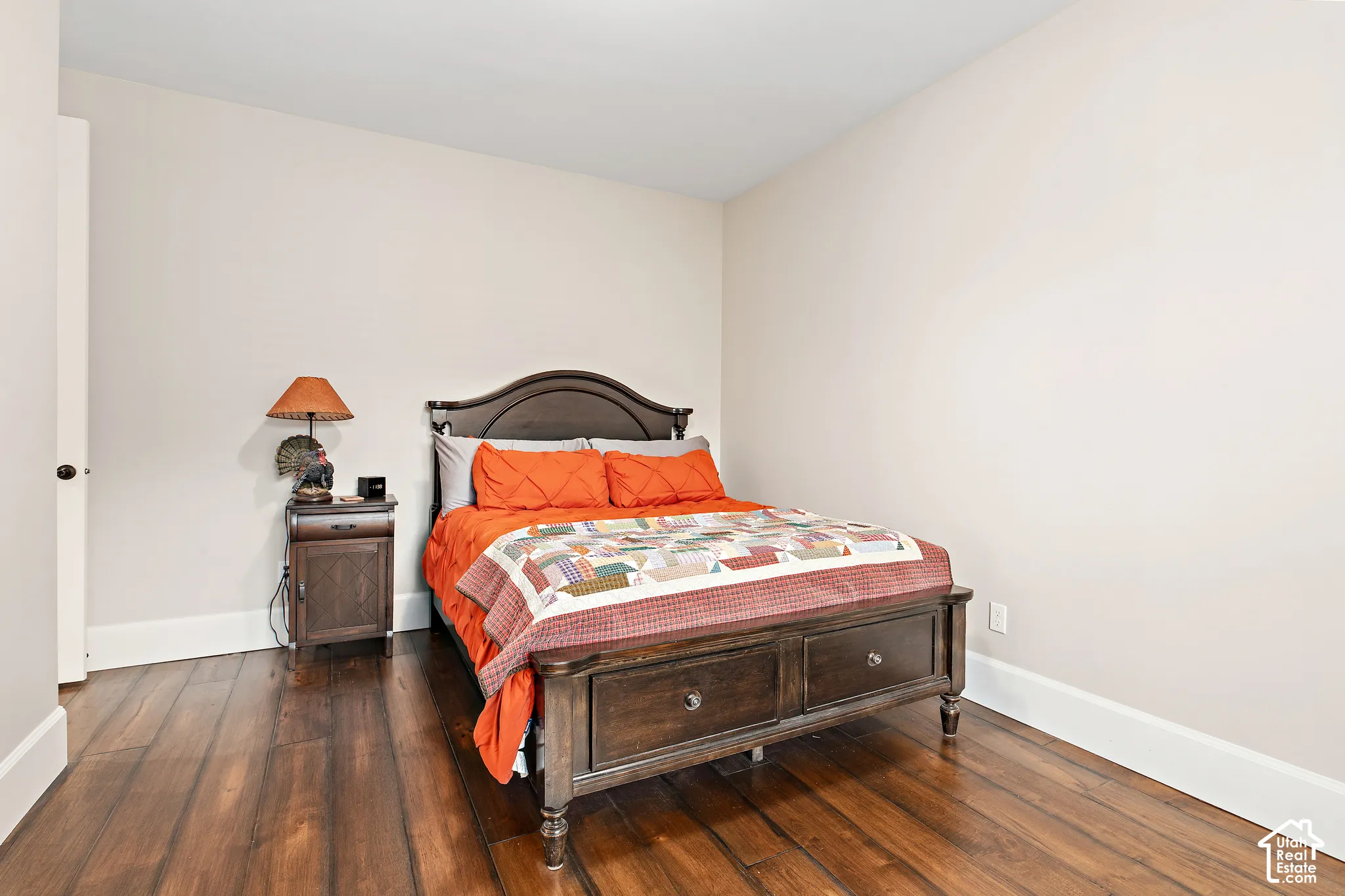 Wood-finish flooring with a satin sheen and light-toned walls