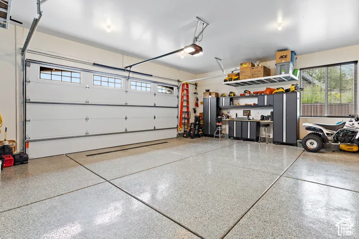 Two large garage doors with upper window panels